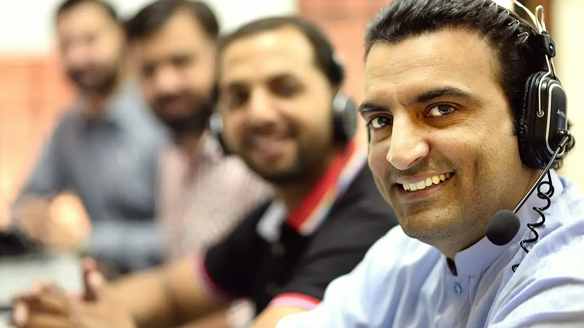 A sales team on headsets working through customer follow-up calls